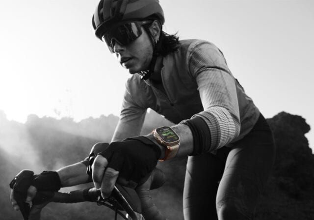 A biker wearing a smartwatch.